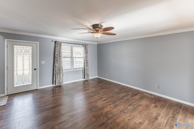 unfurnished room featuring ceiling fan, dark wood-type flooring, and ornamental molding