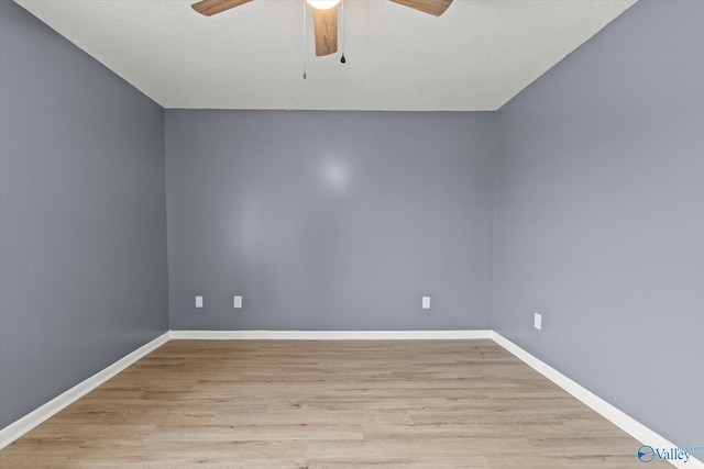 unfurnished room featuring ceiling fan and light wood-type flooring