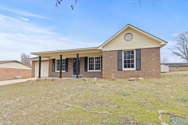 ranch-style home featuring a porch, a garage, and a front lawn