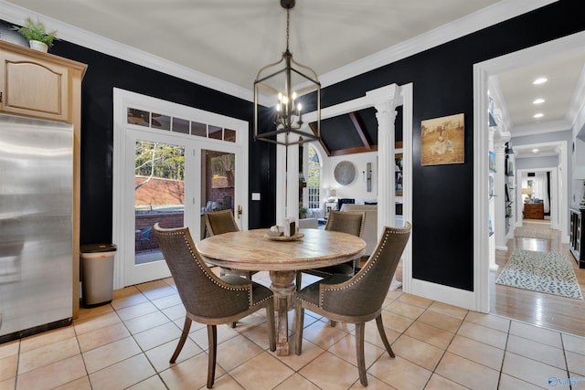 tiled dining room with ornamental molding and a notable chandelier