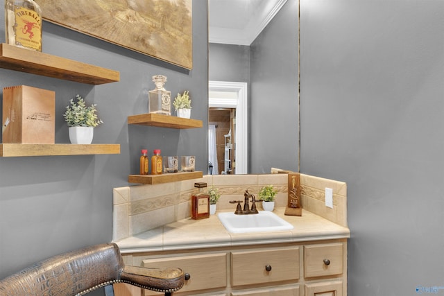 bathroom featuring vanity and crown molding