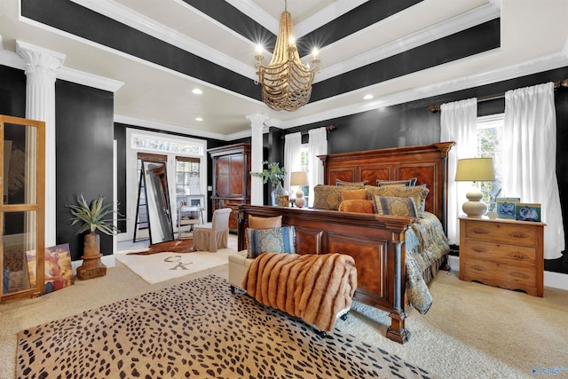 bedroom featuring ornamental molding, a raised ceiling, and ornate columns