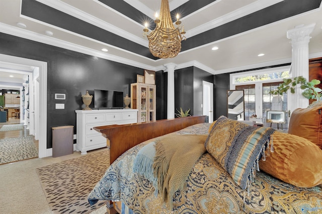 bedroom featuring crown molding, a tray ceiling, a notable chandelier, light colored carpet, and decorative columns