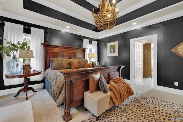 carpeted bedroom featuring crown molding, ensuite bath, a raised ceiling, and a notable chandelier