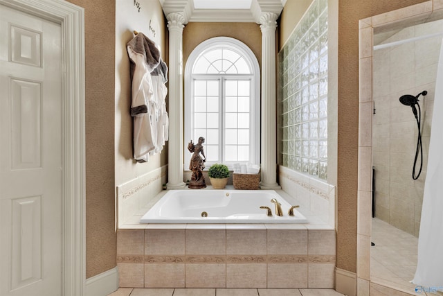 bathroom featuring tile patterned floors, ornamental molding, decorative columns, and shower with separate bathtub