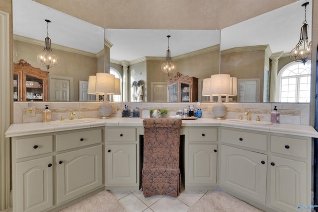 bathroom with backsplash, a notable chandelier, and ornamental molding