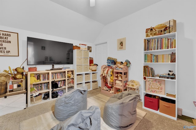 game room with lofted ceiling and carpet