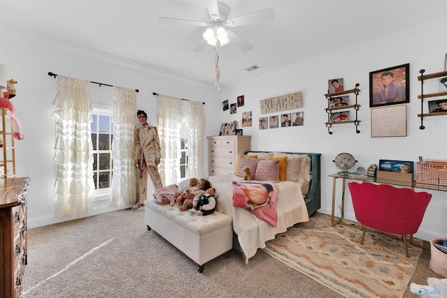 carpeted bedroom with crown molding and ceiling fan