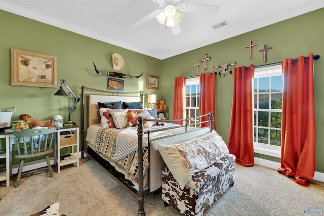 bedroom featuring ceiling fan and carpet