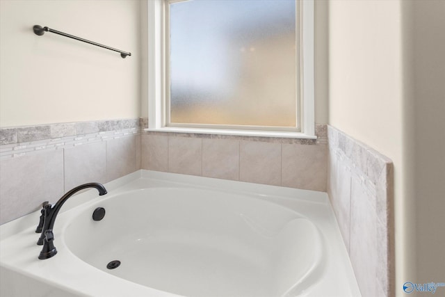 bathroom featuring a tub to relax in