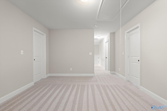 spare room with light colored carpet