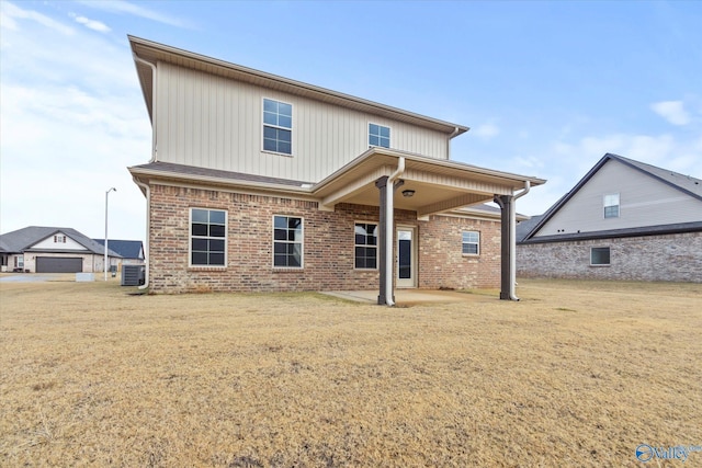 back of property with a patio area and central AC