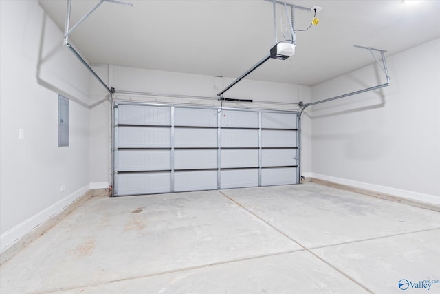 garage with a garage door opener and electric panel