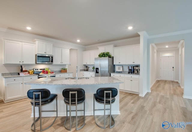 kitchen featuring white cabinetry, appliances with stainless steel finishes, and sink