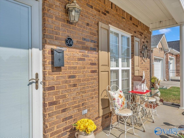 304 Santana Dr, Athens, AL 35611 - view of patio with an attached garage and a porch