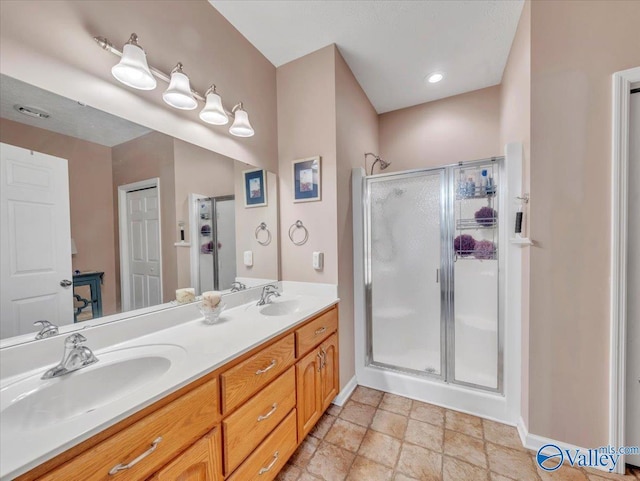 304 Santana Dr, Athens, AL 35611 - bathroom featuring a stall shower, baseboards, and double vanity