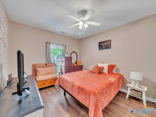 304 Santana Dr, Athens, AL 35611 - bedroom featuring wood finished floors and ceiling fan