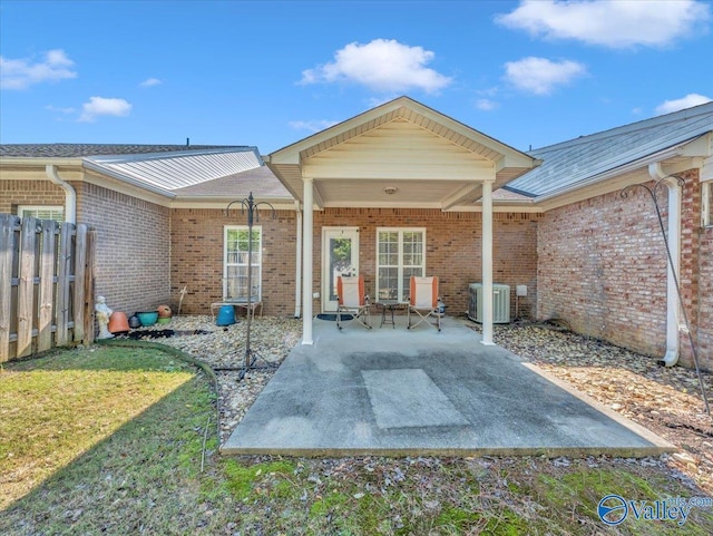 304 Santana Dr, Athens, AL 35611 - back of property with a patio, brick siding, and central AC unit
