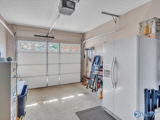 304 Santana Dr, Athens, AL 35611 - garage with white fridge with ice dispenser and a garage door opener