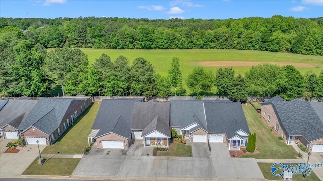 304 Santana Dr, Athens, AL 35611 - aerial perspective of suburban area featuring a forest