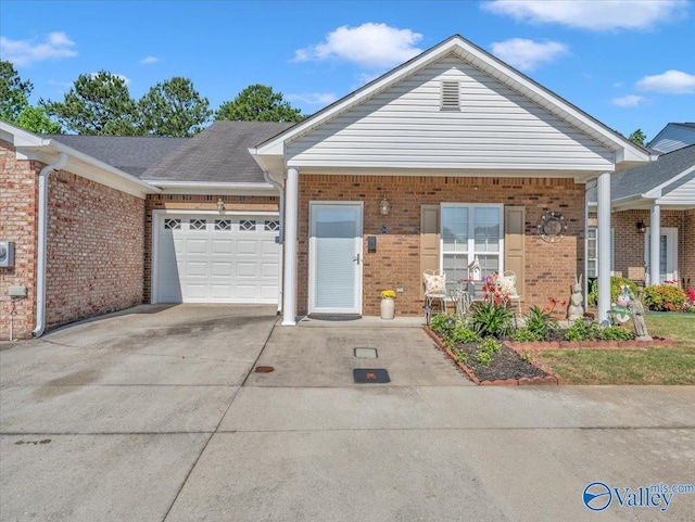 304 Santana Dr, Athens, AL 35611 - view of front facade with brick siding, an attached garage, and concrete driveway