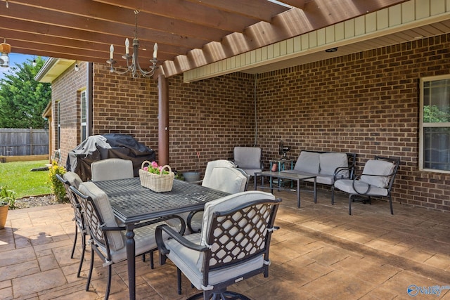 view of patio with grilling area, an outdoor living space, fence, and outdoor dining space