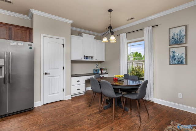 dining room with crown molding, dark wood-style flooring, and baseboards