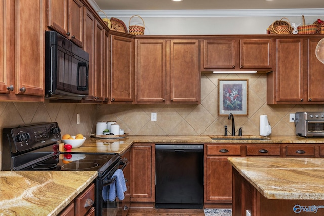 kitchen featuring black appliances, a sink, ornamental molding, light stone countertops, and backsplash