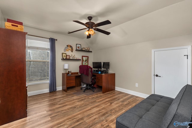 office with ceiling fan, wood finished floors, baseboards, and lofted ceiling