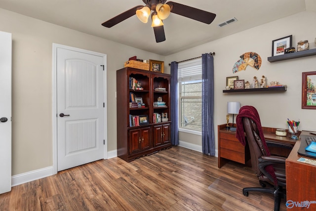 office space with wood finished floors, ceiling fan, and baseboards