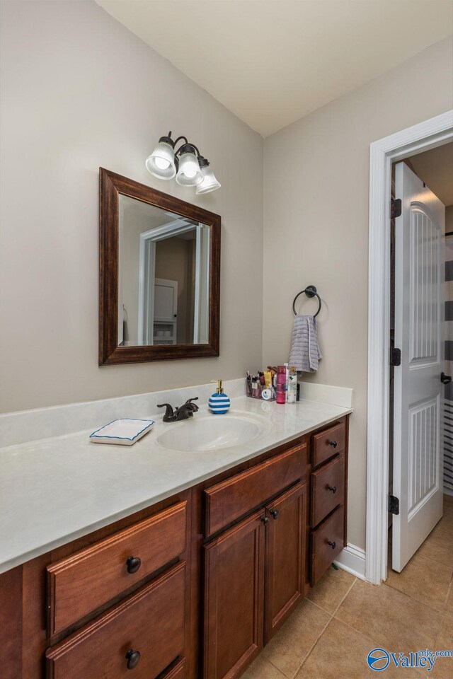 bathroom featuring tile patterned floors and vanity