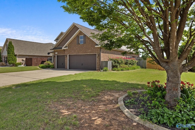 view of front of home featuring brick siding and driveway