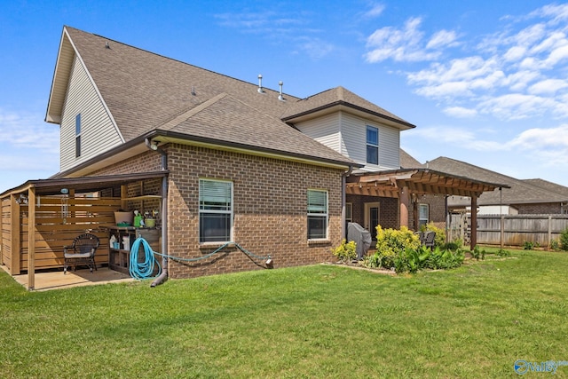 rear view of house featuring a pergola, brick siding, a patio, and a shingled roof