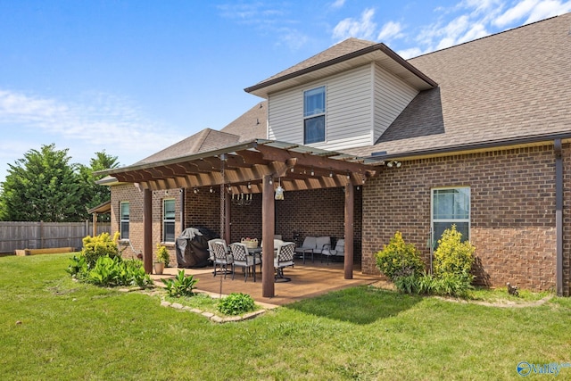 rear view of property featuring a pergola, brick siding, a patio area, and roof with shingles