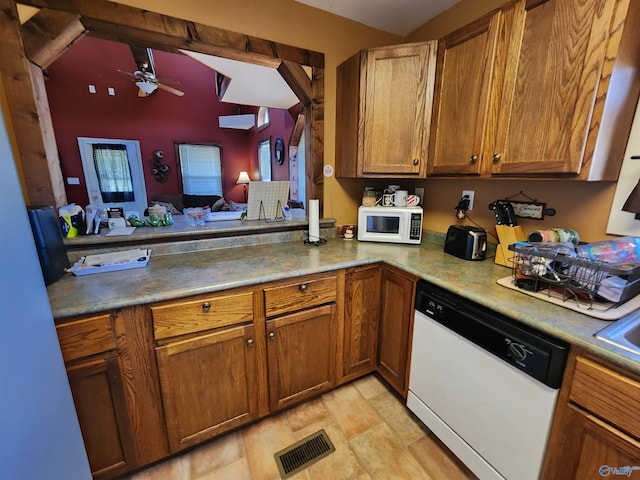 kitchen featuring kitchen peninsula, ceiling fan, sink, and white appliances