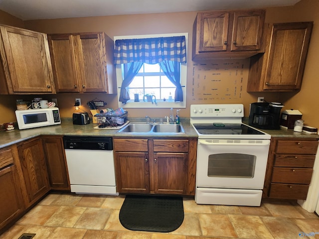 kitchen with white appliances and sink