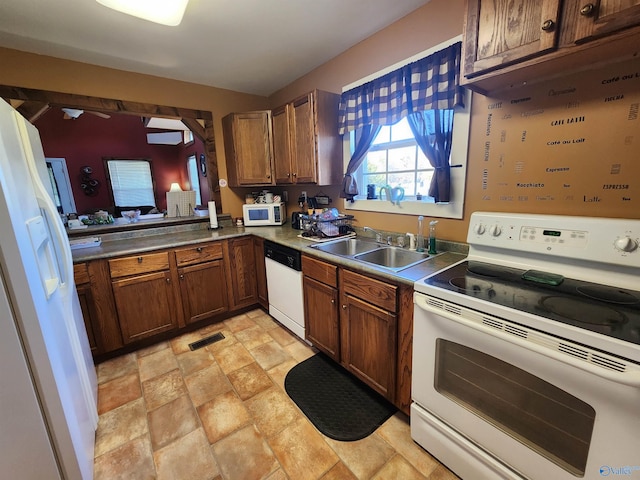 kitchen featuring sink and white appliances