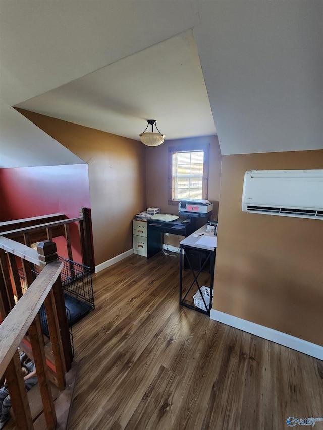 home office featuring a wall mounted air conditioner and dark hardwood / wood-style floors