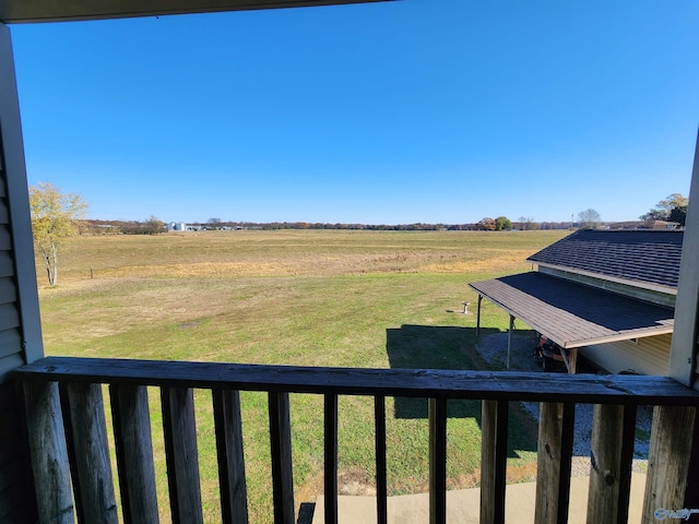 view of yard with a rural view