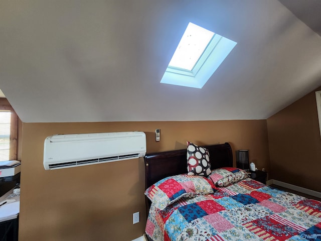 bedroom featuring vaulted ceiling with skylight and a wall unit AC