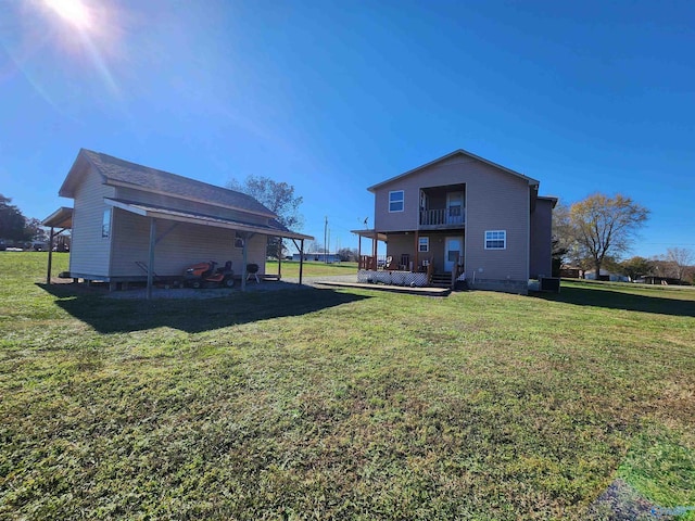 back of property featuring a lawn