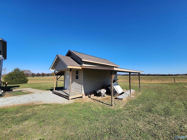 exterior space with a rural view and a lawn