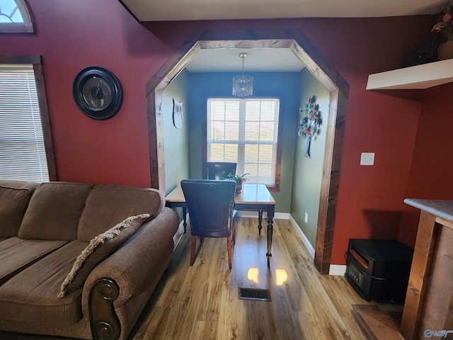 dining room featuring a chandelier and light hardwood / wood-style flooring