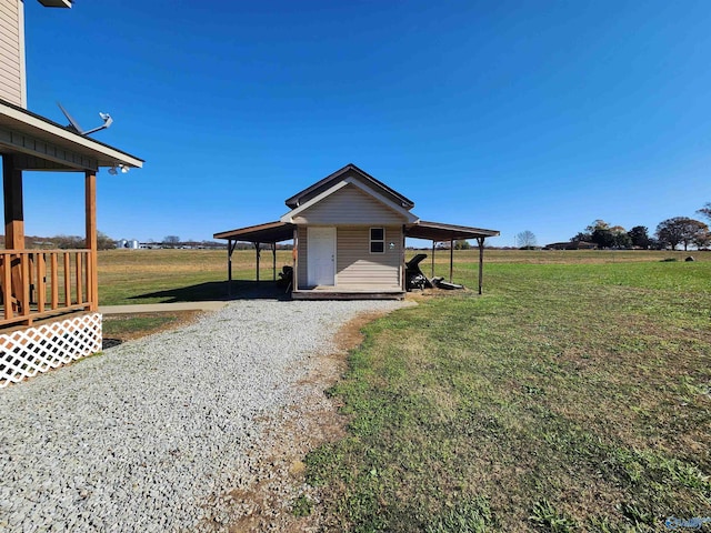 exterior space with a rural view and a carport