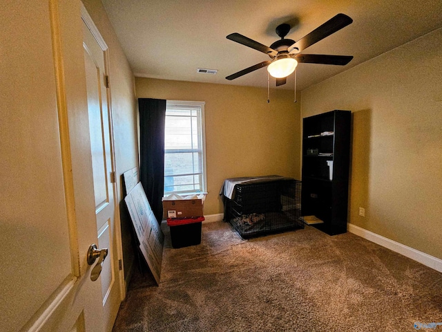 carpeted bedroom featuring visible vents, ceiling fan, and baseboards