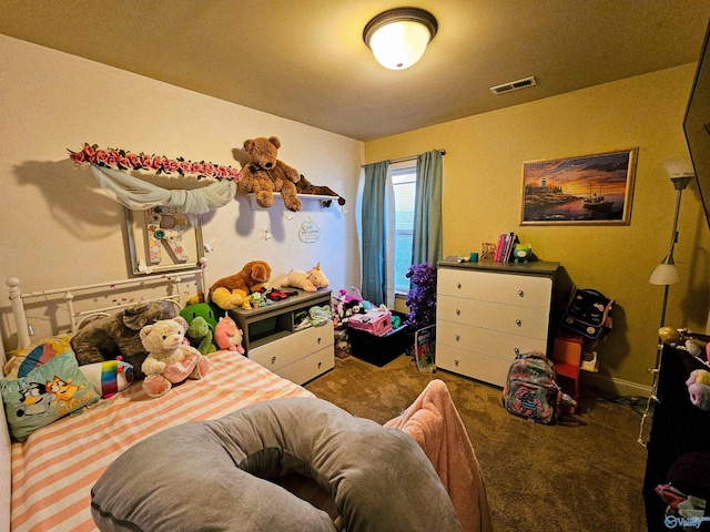 carpeted bedroom featuring visible vents