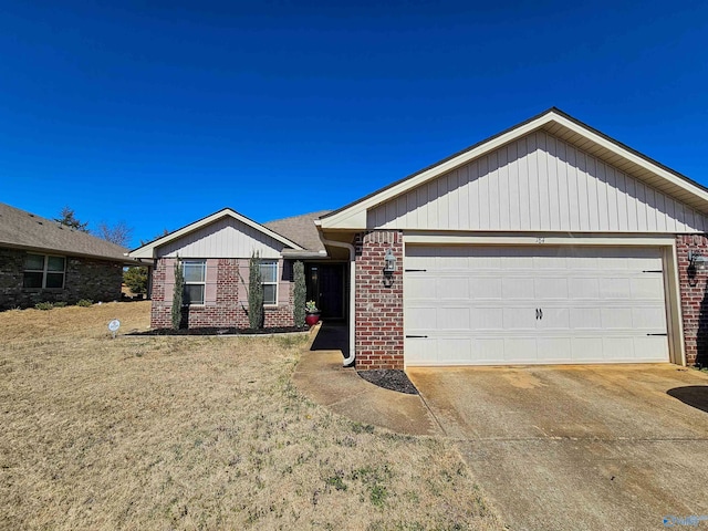 single story home featuring brick siding, driveway, and a garage