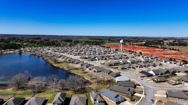 drone / aerial view with a residential view and a water view