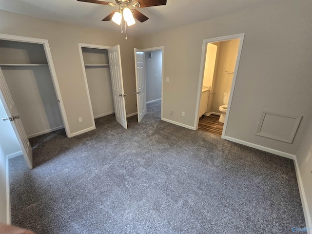 2005 Reaches Pl Unit B, Huntsville, AL 35802 - unfurnished bedroom with two closets, dark carpet, baseboards, ensuite bathroom, and ceiling fan