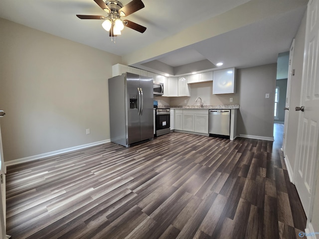 2005 Reaches Pl Unit B, Huntsville, AL 35802 - kitchen with stainless steel appliances, a sink, dark wood-style floors, baseboards, and white cabinetry